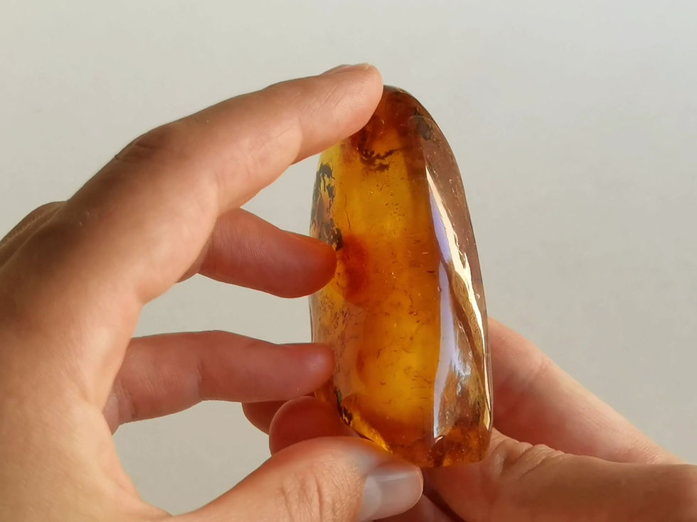 Thumbnail: Natural amber shiny honey color souvenir with a cloud and skin