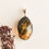 Thumbnail: Natural Baltic amber light and dark green colors faceted oval pendant