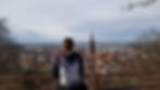 Woman overlooking a cityscape.