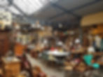 Thrift shop filled with vintage furniture.