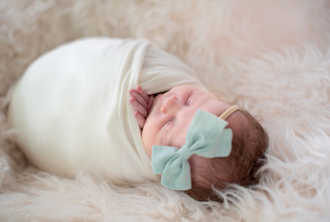 Newborn, newborn photographer, photography, studio, session, white, creams, neutrals,  lace, bead, pearls, headband, flokati, potato sack, newborn posing, newborn wrapping, brown hair, curly hair, portrait, mint bow