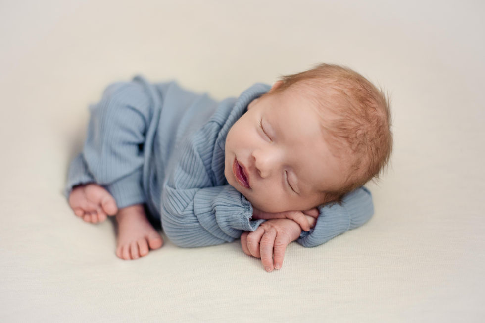 Newborn Photography, photographer, studio, natural light, taco pose, womb pose, cream, blue, baby boy, 2 weeks old. head on hands