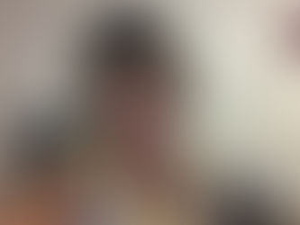 Cyntoria - a woman smiling while looking at the camera