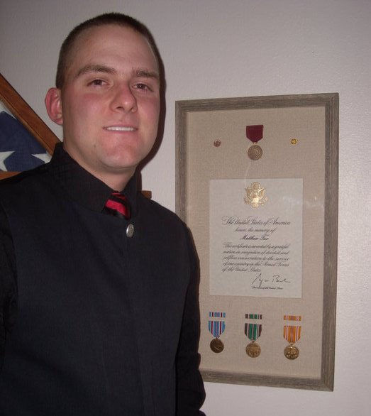 Matt with grandfather Matt Walsh's WWII medals