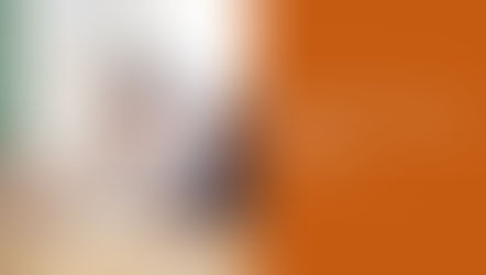 Front page image of SimCorp next generation platform with an elderly person explaining something to a younger man.