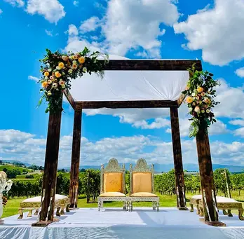 Experience the beauty of a **Bespoke Floral Rustic Mandap** by Bollywood Mandaps in Melbourne, designed to create a unique, intimate atmosphere for your wedding ceremony. Our rustic mandap is fully customizable, featuring stunning fresh or faux florals that can be tailored to your color scheme and preferences. Combining natural elements with elegant floral arrangements, this mandap adds a touch of rustic charm and elegance to your special day. Perfect for couples looking for a personal, romantic setting, our bespoke designs also include soft sheer curtains and traditional touches like a Ganesh statue at the entrance. Create unforgettable memories with a rustic floral mandap that reflects your love and style. Contact Bollywood Mandaps today for a personalized consultation.