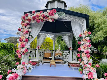 Elevate your wedding or event with stunning floral gazebo décor by Bandhan Events Our beautifully designed gazebos are adorned with lush, intricate floral arrangements, creating a romantic and enchanting ambiance. Perfect for outdoor ceremonies or as a striking centerpiece, these gazebos can also be seamlessly transformed into mandaps for traditional weddings. With bespoke options available, we tailor every detail to match your vision, incorporating your chosen colors, themes, and style. Whether you desire classic elegance or a modern twist, our floral gazebo décor promises to leave a lasting impression, making your special day truly unforgettable.