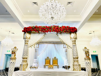 Discover the elegance of our Haveli Mandap by Bandhan Events, a stunning 4-pillar structure perfect for traditional weddings. Fully customizable with luxurious florals, it creates a breathtaking centerpiece tailored to your vision. Designed to reflect timeless charm and cultural significance, the Haveli Mandap can be adorned with your choice of flowers, colors, and fabrics to suit your theme. Ideal for Melbourne weddings, this mandap blends tradition with bespoke artistry, ensuring a memorable setting for your special day. Let us help bring your dream wedding to life with our beautifully crafted, customizable Haveli Mandap.