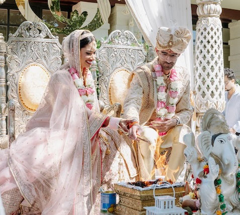 Discover the elegance of our Haveli Mandap by Bandhan Events, a stunning 4-pillar structure perfect for traditional weddings. Fully customizable with luxurious florals, it creates a breathtaking centerpiece tailored to your vision. Designed to reflect timeless charm and cultural significance, the Haveli Mandap can be adorned with your choice of flowers, colors, and fabrics to suit your theme. Ideal for Melbourne weddings, this mandap blends tradition with bespoke artistry, ensuring a memorable setting for your special day. Let us help bring your dream wedding to life with our beautifully crafted, customizable Haveli Mandap.