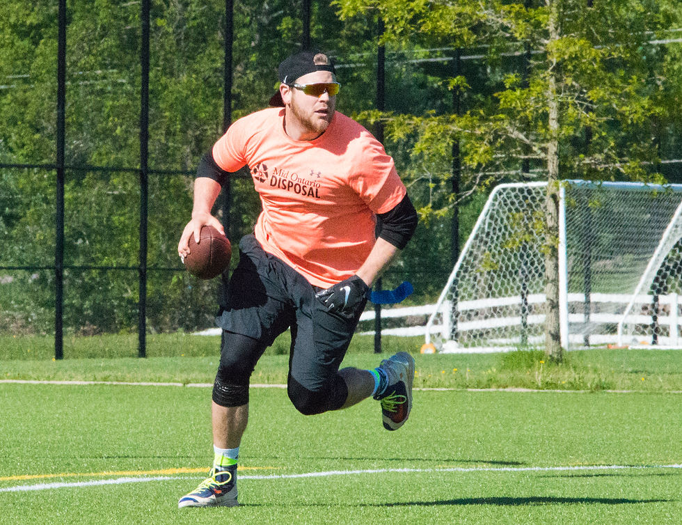 Braeden Price scrambles during a flag football game in 2019 at the West Orillia Sports Complex.