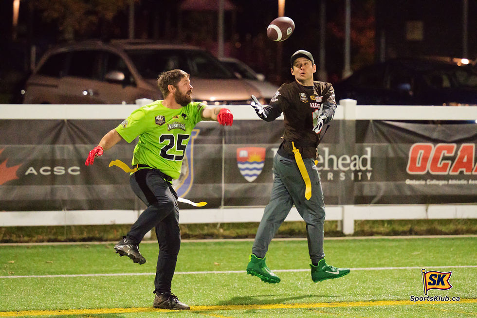 A lobbed pass makes it over the head of Wagner Lawn Care defender Ben Prinzen and into the hands of Hotshots Sandblasting receiver Scott Oliver during SportsKlub Orillia Flag Football action on Sunday night at the West Orillia Sports Complex.