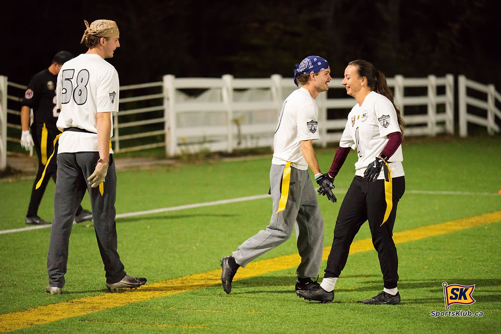 CMF Automotive players Luke Phillips and Marisa Bremner connect on a high five during SportsKlub Orilla Flag Football action at the West Orillia Sports Complex.