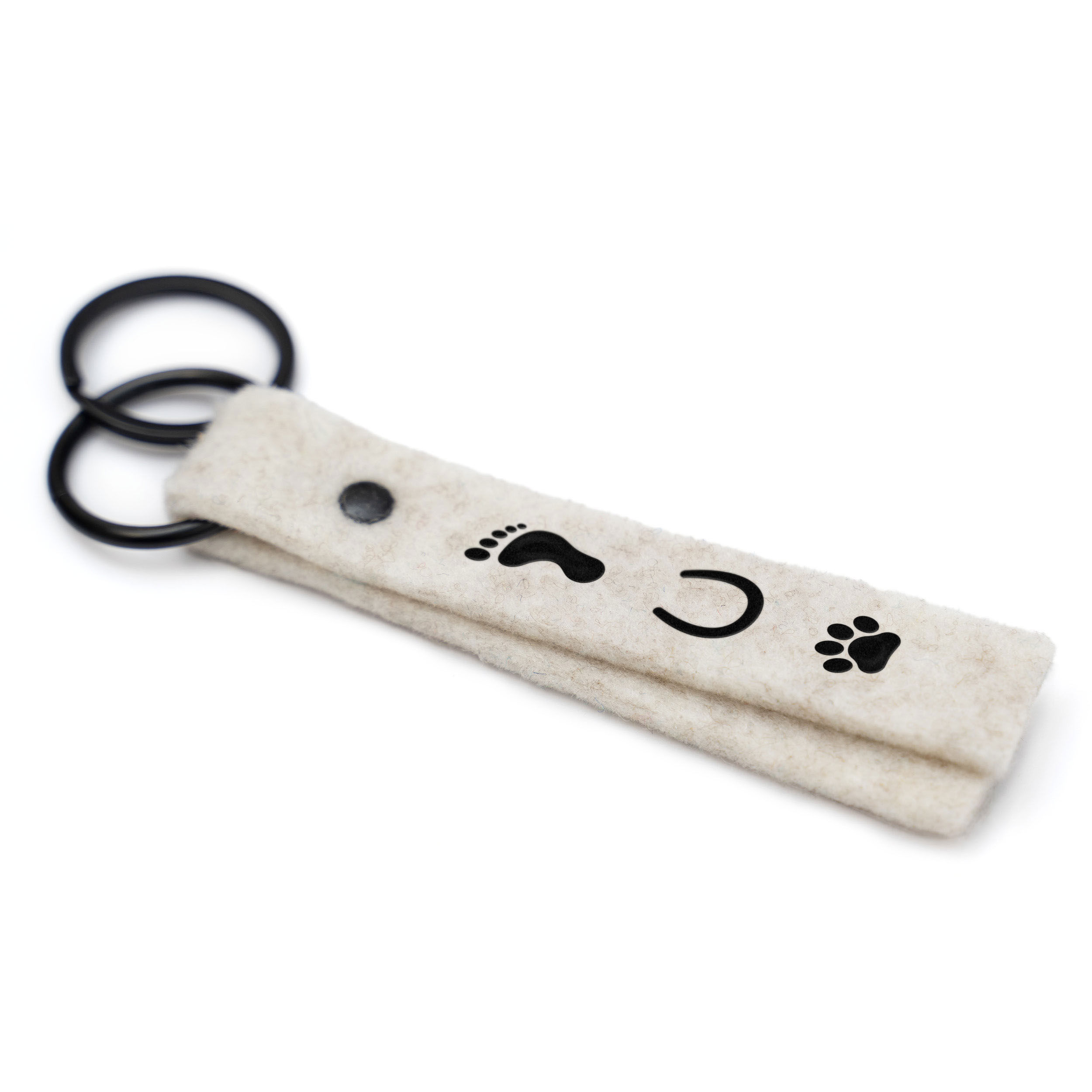 Vorderseite Schluesselanhaenger mit "Hund Mensch Pferd" Motiv, Farbe Cream, Beschlag Schwarz