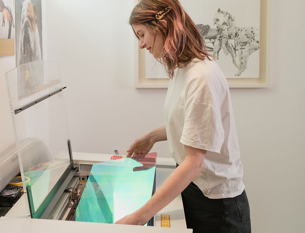 Kissamo's founder laser cutting in their Vancouver studio