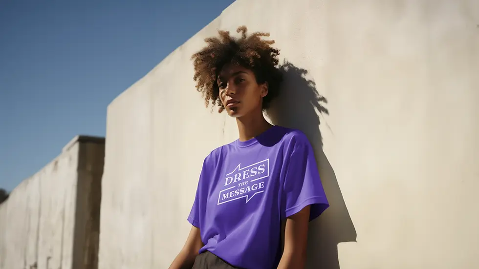 Young woman wearing purple Guess t-shirt, leaning against a wall