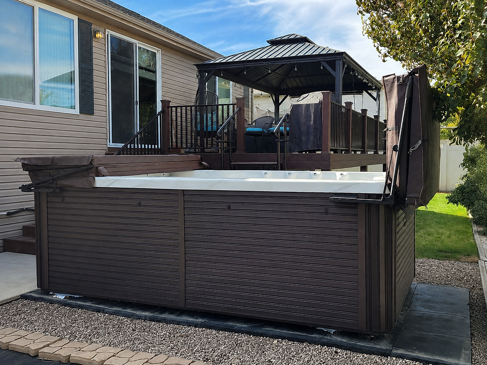 Swim spa installed beside a raised backyard deck