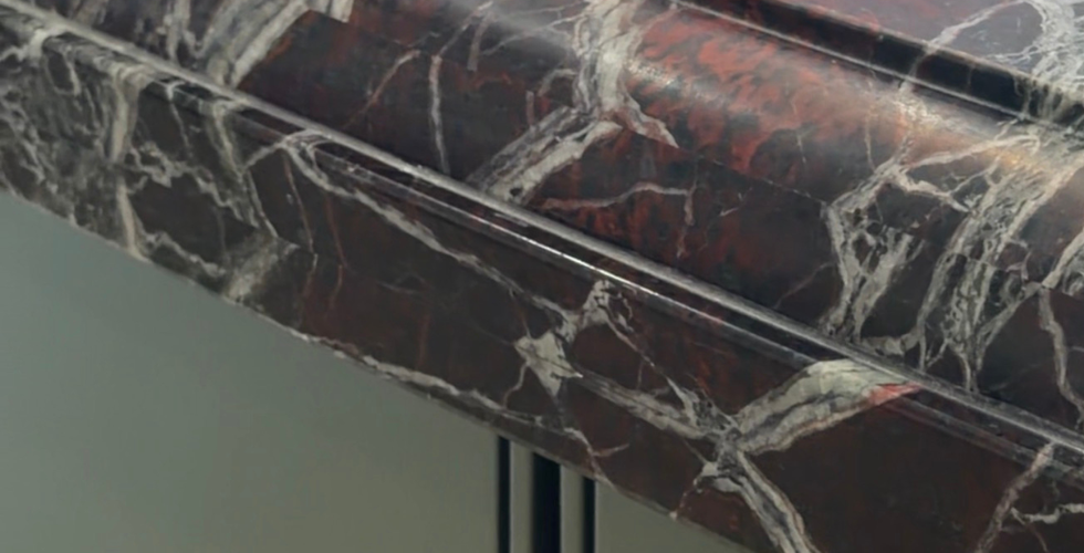 Close-up of a finished stone black countertop with white veining