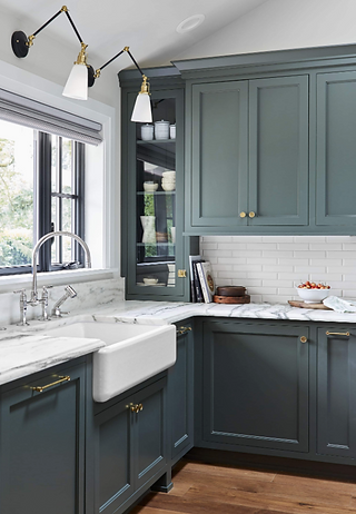 sherwin williams Pewter Green kitchen cabinets, white counters and farmhouse sink
