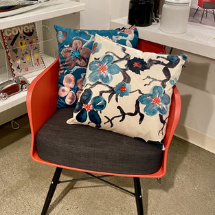 red side chair, red chair, floral pillows