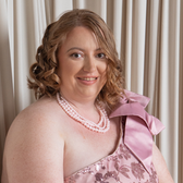 A BLONDE WOMAN IN PINK