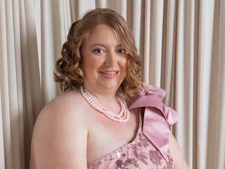 A BLONDE WOMAN IN PINK