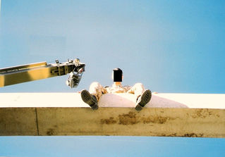 Charlie Aston sat on bridge girder, Canada