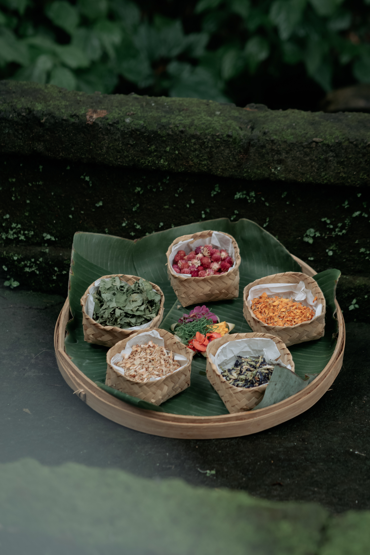 balinese herbs and plants on banana leaves basket