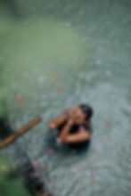 woman-during-purification-ritual-in-bali-in-holy-springs-at-sacred-temple.jpg