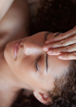 Woman getting Reiki Treatment