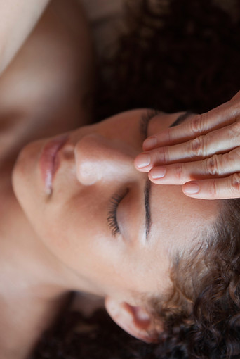 Woman getting Reiki Treatment