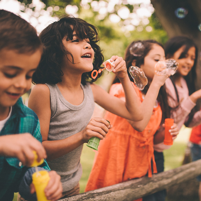 kids blowing bubbles