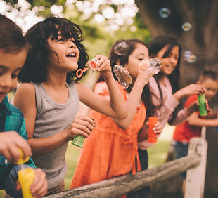 Bambini Blowing Bubbles