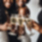 black women hands only champagne toast.jpg