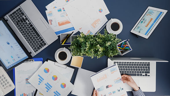 top-view-manager-woman-analyzing-financial-paperwork-strategy-typing-expertise-laptop.jpg