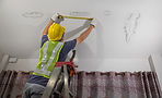 Superior Roofing crew repairing water-damage roof and ceiling