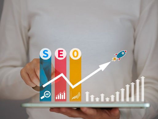 Person touches a tablet with SEO bars in blue, red, and yellow rising. White arrows and a rocket symbolize growth on a gray background.