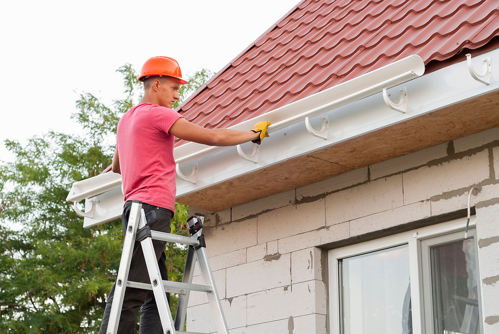 Seamless gutters being installed on Calgary home