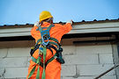 Technician identifying early signs of roof deterioration