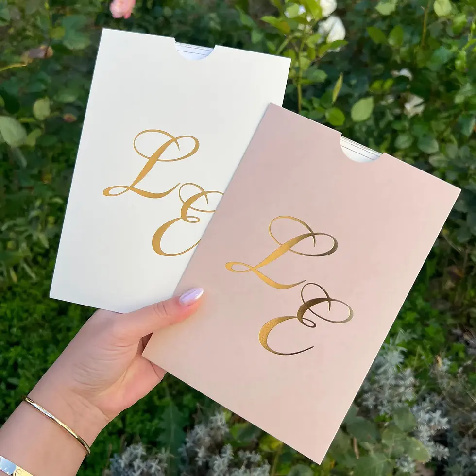 Thumbnail: Two cream and pink envelopes with gold lettering, 