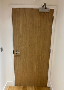 A fire-rated FD30S flat front door with a smooth, durable surface, designed for safety and compliance in residential and comm