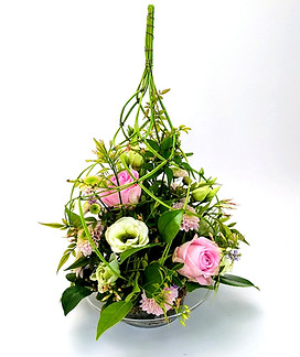 Midolino flower arrangement with roses, chrysanthemums, lisianthus