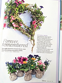 Heart shaped floral wreath with spring plants nestling in a contorted willow frame and entwining ivy trails