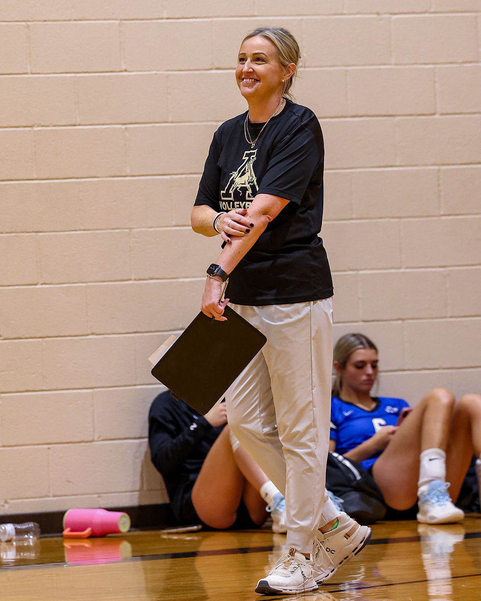 Coach Dyches coaching the Lady Mustangs in Abilene at the Bev Ball Classic.
