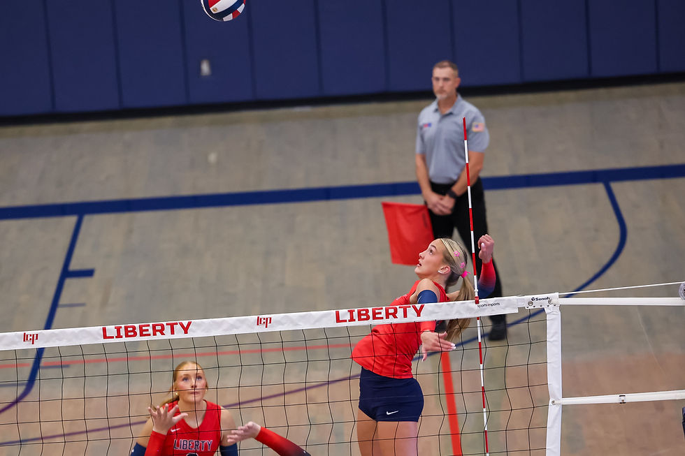 Liberty's Ryleigh Conner goes for the kill. (Steven Liles for Sideline Sports)