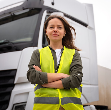 medium-shot-professional-female-driver-outdoors.jpg