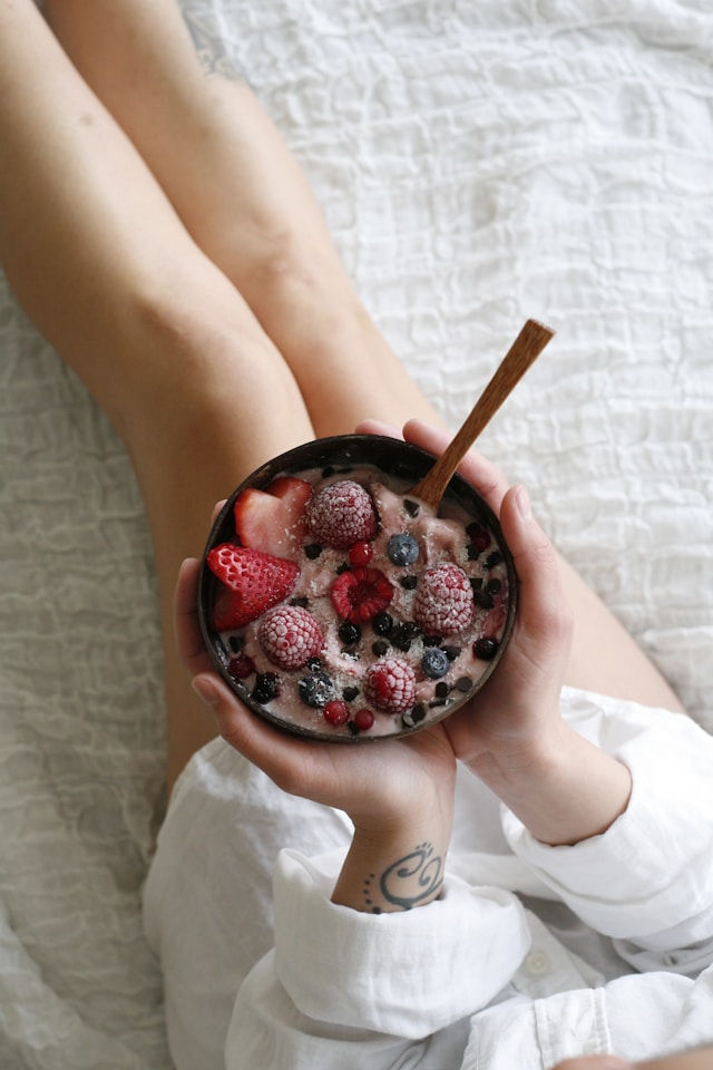 woman eating a well balanced breakfast