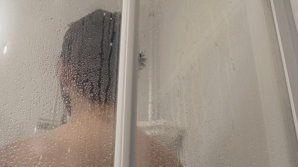 man showering in tattoo