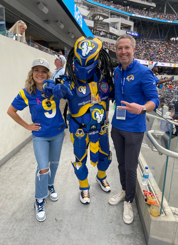 Dr. Elbert and Rita with LA Rams Super Fan Ramator