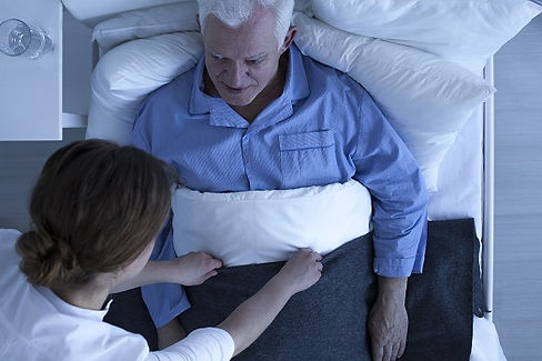 tucking in elderly man.jpg