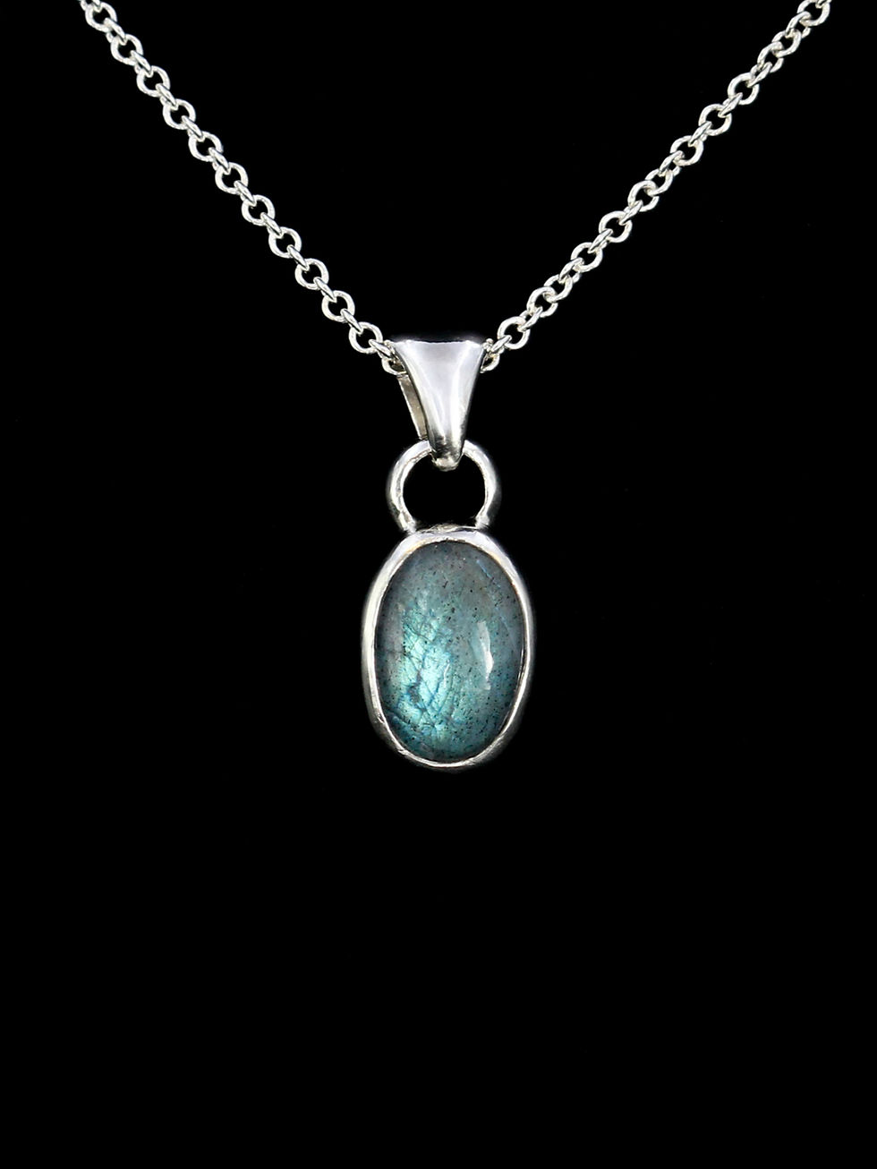 glowing labradorite stone set in silver pendant